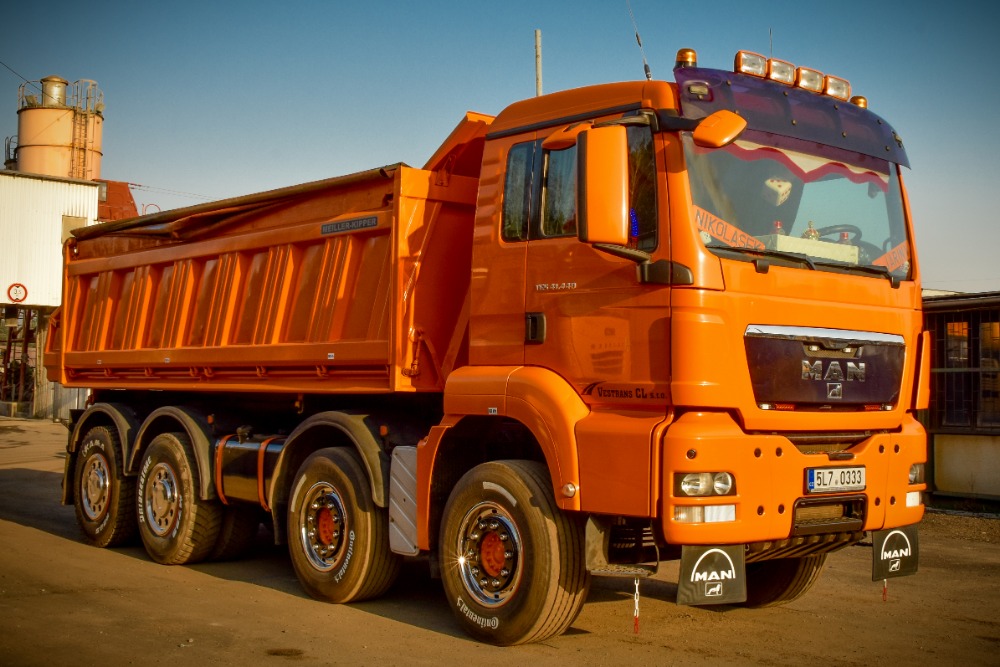 MAN TGA F46 osmikolo Vestrans – oranžový sklápěč